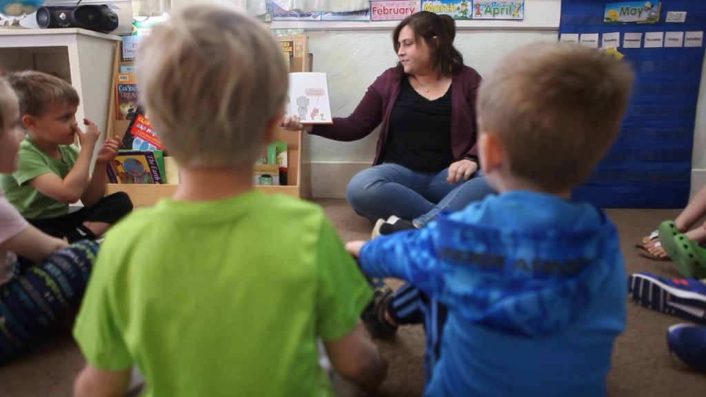 California teacher working with students.