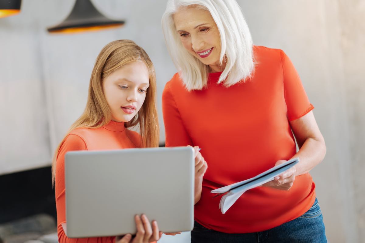 Nice smart girl holding a laptop